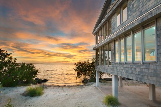 enjoy beautiful sunsets in this luxury waterfron home in key largo with a private beach